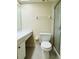 Bathroom with a toilet, vanity, and enclosed shower stall at 4920 Locust Ne St # 116, St Petersburg, FL 33703