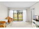 Bright living room with sliding glass doors offering a view of the outdoors at 4920 Locust Ne St # 116, St Petersburg, FL 33703