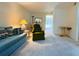 A comfortable living room leads to a dining area and a glimpse of the outdoor landscape at 4920 Locust Ne St # 116, St Petersburg, FL 33703
