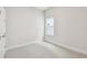 Cozy bedroom featuring a bright window and neutral carpet at 5289 Everlong Dr, Apollo Beach, FL 33572