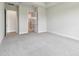 Spacious bedroom with neutral carpet, bathroom and walk-in closet at 5289 Everlong Dr, Apollo Beach, FL 33572