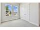 Bright bedroom with dual windows, neutral paint, and plush carpeting at 5289 Everlong Dr, Apollo Beach, FL 33572
