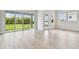 Bright living room with large sliding glass doors leading to a well-maintained green backyard at 5289 Everlong Dr, Apollo Beach, FL 33572