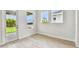Bright room with light wood floors and a door leading to the outside at 5289 Everlong Dr, Apollo Beach, FL 33572