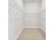 Spacious walk-in closet with ample storage and custom shelving at 5289 Everlong Dr, Apollo Beach, FL 33572