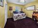 Bedroom showcasing a charming daybed, complemented by bright lighting, creating a cozy ambiance at 5309 21St S Ave, Gulfport, FL 33707