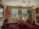 Cozy dining room features wood table and chairs, natural light, and open bookcase at 5309 21St S Ave, Gulfport, FL 33707