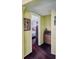 Hallway features charming furnishings, including a classic writing desk, and view into the bedroom at 5309 21St S Ave, Gulfport, FL 33707