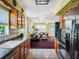 Bright eat-in kitchen flows into a spacious living area, with wood cabinets and stainless steel refrigerator at 5309 21St S Ave, Gulfport, FL 33707