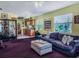 Living room shows view into kitchen, natural light from windows, and the purple sofa at 5309 21St S Ave, Gulfport, FL 33707