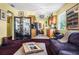 Charming living room with access to the kitchen featuring purple sofa, and a decorative screen at 5309 21St S Ave, Gulfport, FL 33707
