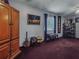 Comfortable living room featuring wood armoire and decorations, with large window at 5309 21St S Ave, Gulfport, FL 33707