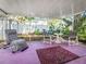 Enclosed patio featuring comfortable seating, providing a peaceful outdoor experience at 5309 21St S Ave, Gulfport, FL 33707