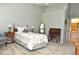Cozy bedroom featuring carpet, floral bedding, and classic vintage-style decor at 5581 Salem Square S Dr, Palm Harbor, FL 34685