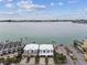 Expansive waterfront property featuring charming architecture, lush landscaping, and convenient parking at 800 Madonna Blvd # 2, Tierra Verde, FL 33715
