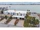 Waterfront homes with convenient parking provide a glimpse of luxurious coastal living with easy access to amenities and stunning views at 800 Madonna Blvd # 2, Tierra Verde, FL 33715