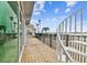 Outdoor patio features white spiral staircase, pool, and serene waterfront views at 800 Madonna Blvd # 2, Tierra Verde, FL 33715