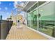 Spacious outdoor patio with white spiral staircase and waterfront pool view at 800 Madonna Blvd # 2, Tierra Verde, FL 33715