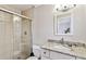 Well-lit bathroom with granite countertop and enclosed shower for easy maintenance at 800 Madonna Blvd # 2, Tierra Verde, FL 33715
