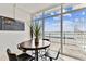 Bright dining area boasts floor-to-ceiling windows with pool and water views at 800 Madonna Blvd # 2, Tierra Verde, FL 33715