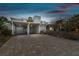 Charming single Gathering home with a two-car carport featuring a stylish brick driveway and unique facade at 800 Madonna Blvd # 2, Tierra Verde, FL 33715