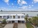 Stylish waterfront home with covered parking and a waterfront view that offers the perfect combination of comfort and coastal living at 800 Madonna Blvd # 2, Tierra Verde, FL 33715