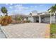 Charming single Gathering home with a two-car carport featuring a stylish brick driveway and unique facade at 800 Madonna Blvd # 2, Tierra Verde, FL 33715