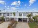 Stylish waterfront home with a carport, offering a blend of modern design and convenient parking at 800 Madonna Blvd # 2, Tierra Verde, FL 33715