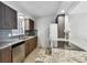 This kitchen features modern appliances, granite countertops, and ample storage space for cooking and storage at 800 Madonna Blvd # 2, Tierra Verde, FL 33715