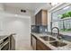 Updated kitchen features granite counters, stainless steel appliances, and breakfast bar at 800 Madonna Blvd # 2, Tierra Verde, FL 33715