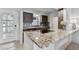 Well-designed kitchen featuring modern appliances, granite countertops, and seamless flow for entertaining at 800 Madonna Blvd # 2, Tierra Verde, FL 33715