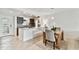 Charming kitchen featuring granite countertops, stainless steel appliances and an island open to the dining area at 800 Madonna Blvd # 2, Tierra Verde, FL 33715