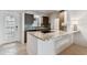 This bright kitchen features sleek appliances, granite countertops, and an island for cooking and entertaining guests at 800 Madonna Blvd # 2, Tierra Verde, FL 33715