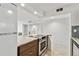 Updated kitchen featuring granite counters, stainless steel appliances, and tile flooring at 800 Madonna Blvd # 2, Tierra Verde, FL 33715