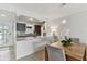 Stylish kitchen with granite countertops and island, seamlessly connected to the dining room, perfect for entertaining at 800 Madonna Blvd # 2, Tierra Verde, FL 33715