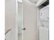 Laundry room with stacked washer and dryer offers convenience and efficiency for everyday tasks at 800 Madonna Blvd # 2, Tierra Verde, FL 33715