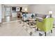 Bright living room with neutral decor, stylish furniture, and tile flooring throughout at 800 Madonna Blvd # 2, Tierra Verde, FL 33715