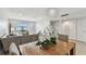 This open concept living space with modern décor and light-filled spaces, connects the dining area with the living space at 800 Madonna Blvd # 2, Tierra Verde, FL 33715