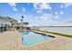 Enjoy waterfront views from this in-ground pool and brick paver deck, ideal for outdoor entertaining and relaxation at 800 Madonna Blvd # 2, Tierra Verde, FL 33715