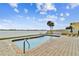 Enjoy this inviting community pool with waterfront views of the intercoastal waterway, a tranquil escape at 800 Madonna Blvd # 2, Tierra Verde, FL 33715