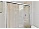 Stylish shower with clear glass doors and neutral tile for a clean look at 800 Madonna Blvd # 2, Tierra Verde, FL 33715