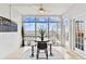 Bright dining area featuring tile floors, a ceiling fan, and large windows with an amazing waterfront view at 800 Madonna Blvd # 2, Tierra Verde, FL 33715