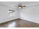 Bright bedroom features hardwood floors and a ceiling fan at 11201 122Nd Ave # 204, Largo, FL 33778