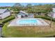 Inviting community pool with ample seating and a covered lounge area at 11201 122Nd Ave # 204, Largo, FL 33778