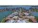 An aerial view of the waterfront community showcases its prime location and beautiful surroundings at 16108 5Th E St, Redington Beach, FL 33708
