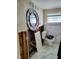 Dilapidated bathroom features damaged walls, a decorative sink, and a matching blue and white mirror at 16108 5Th E St, Redington Beach, FL 33708