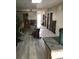 Spacious dining area features updated floors, modern lighting, and room to entertain at 16108 5Th E St, Redington Beach, FL 33708