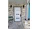 Stylish front door with modern accents and unique stone trim for enhanced curb appeal at 16108 5Th E St, Redington Beach, FL 33708