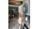 Hallway featuring damaged walls, gray wood-look floors, and overhead beams at 16108 5Th E St, Redington Beach, FL 33708