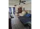 Cozy living room featuring a ceiling fan and comfortable furniture, offering a relaxing atmosphere at 16108 5Th E St, Redington Beach, FL 33708